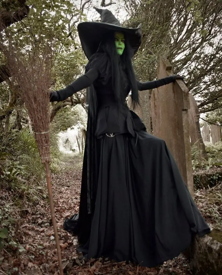 Download Background Image of a Witch with Green Skin in a Forest