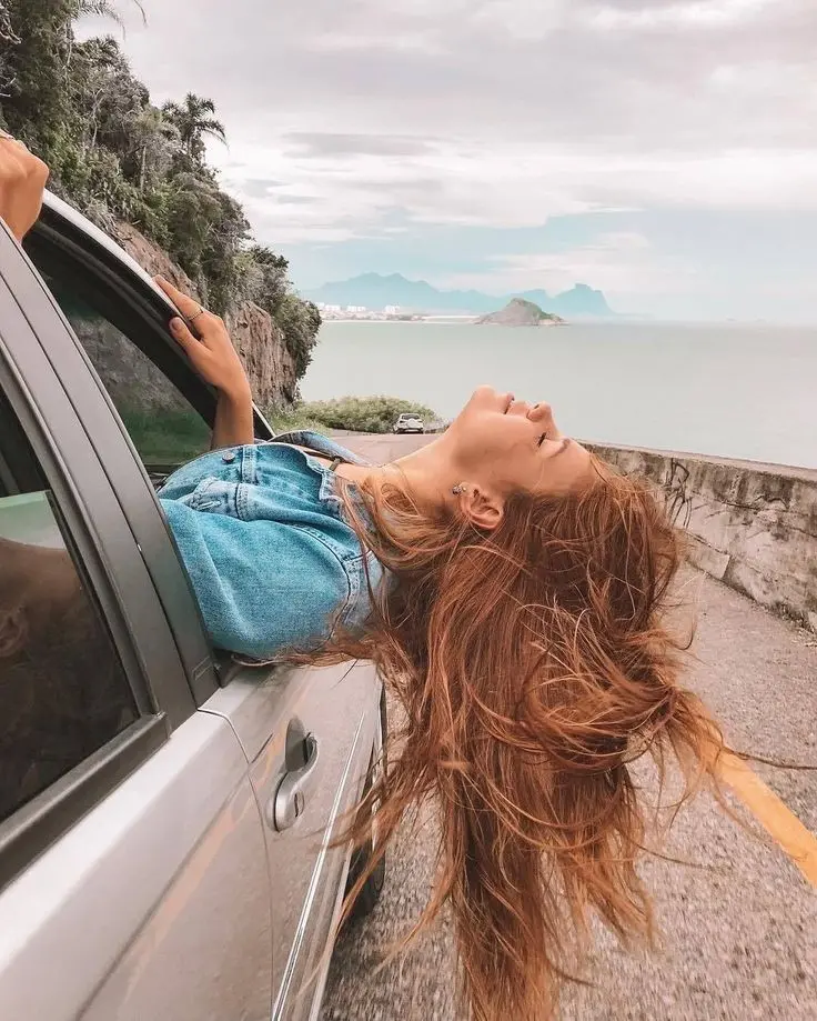 Download Free Spirited Girl in Car Image