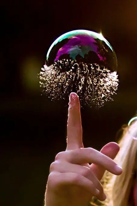 Download Background Image of Popping a Bubble with a Finger