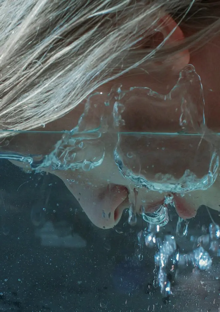 High-Quality Image of a Girl Drowning in Water