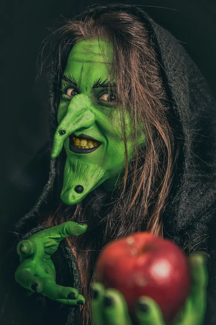 Download Image of a Witch with Yellow Teeth and a Red Apple