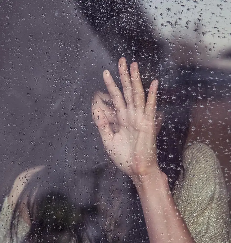 Download Image of a Depressed Girl Behind Glass