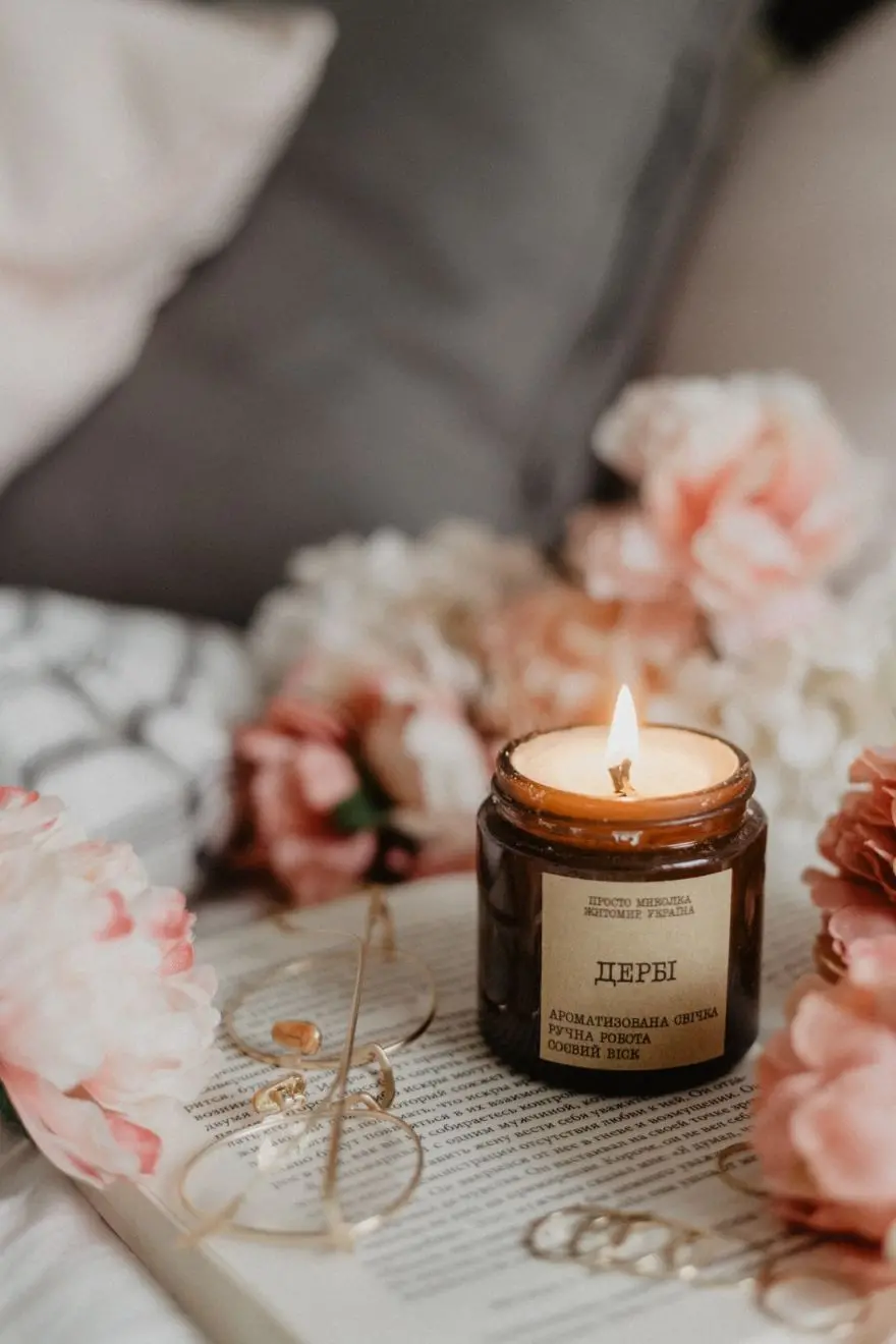 White Candle in Brown Glass Jar Image