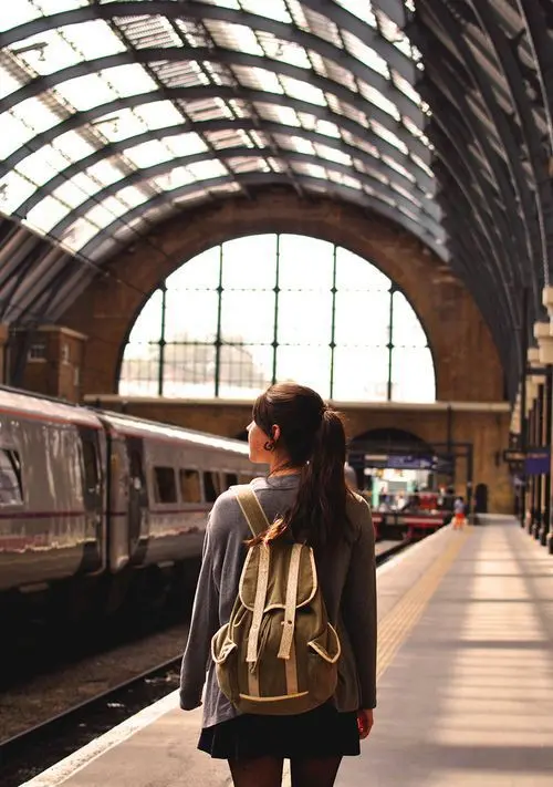 Download Girl with Backpack at Train Station