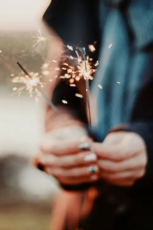 Download Girly Sparkler in Girl's Hand Background