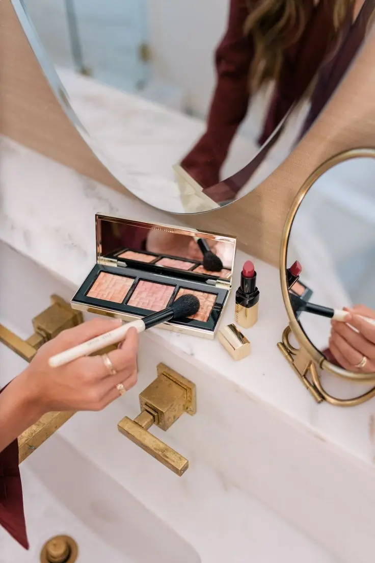 Download High-Quality Image of a Girl Applying Makeup