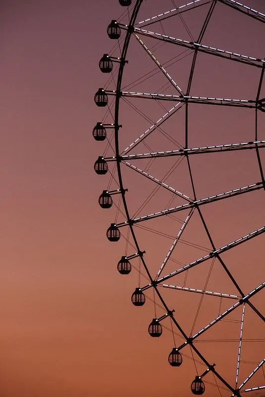 Download Profile Picture of Ferris Wheel in Orange Haze
