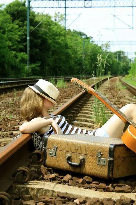 Download Girl Sleeping on Railway Image