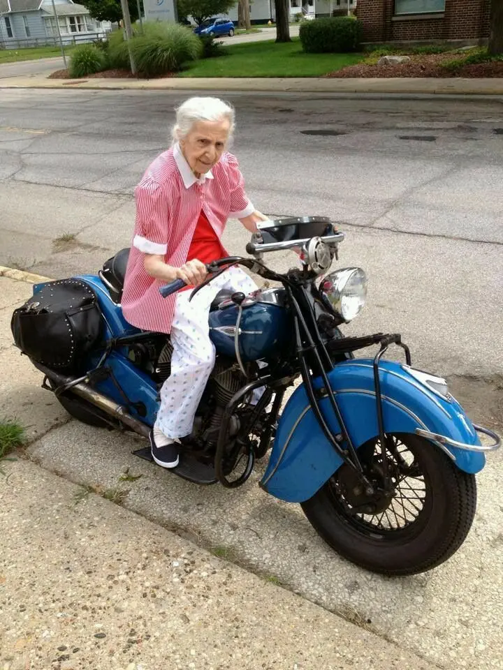 Image of a Playful Brave and Beautiful Elderly Woman on a Motorcycle