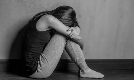 Download Black and White Image of a Sad Girl