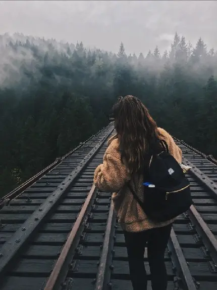 Download Girl on Railway in Dark Forest