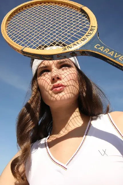 Download Tennis Racket Wallpaper in Girl's Hand