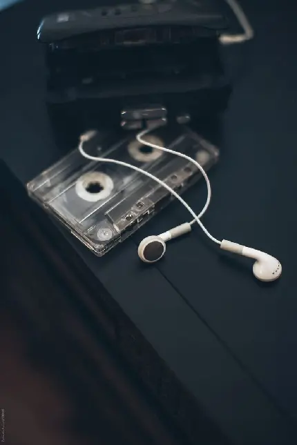 Download 8K Wallpaper of Cassette Tape and Headphones