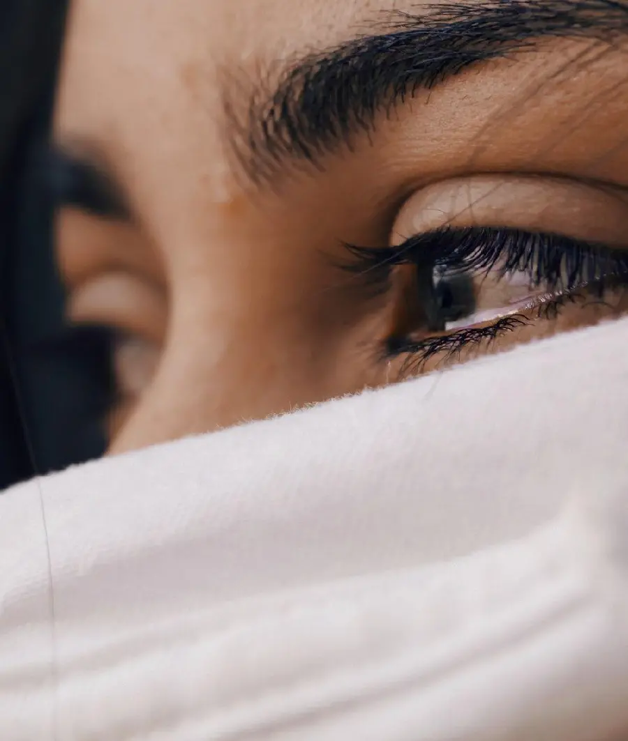 A sad and touching picture of a woman crying for a background