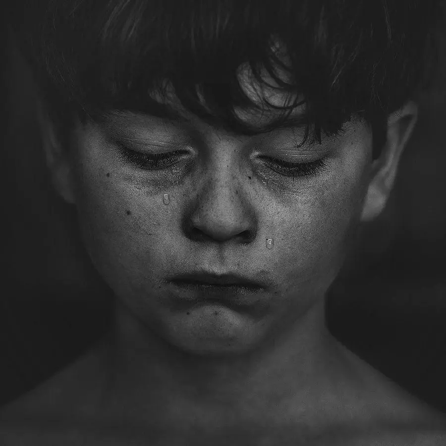 A special black and white picture of a sleeping boy's face for a profile