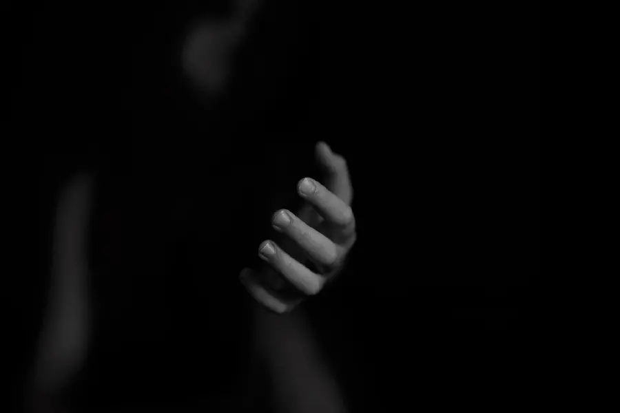 Download black and white wallpaper of a hand stretched out to help