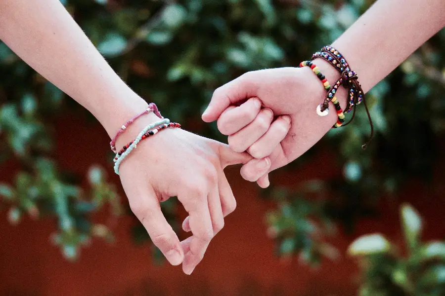 Hands holding each other as a sign of love and affection for each other for profile
