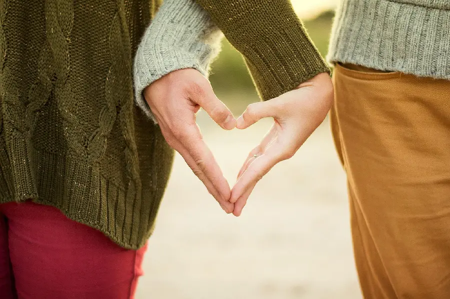 Mobile wallpaper and background of hands that make a heart of life together