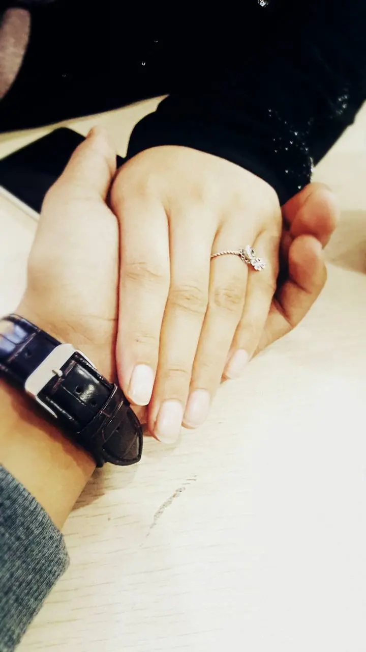 Download stock image of hands of a couple in love 