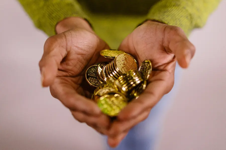 Download image of hands full of gold for wallpaper and motivation