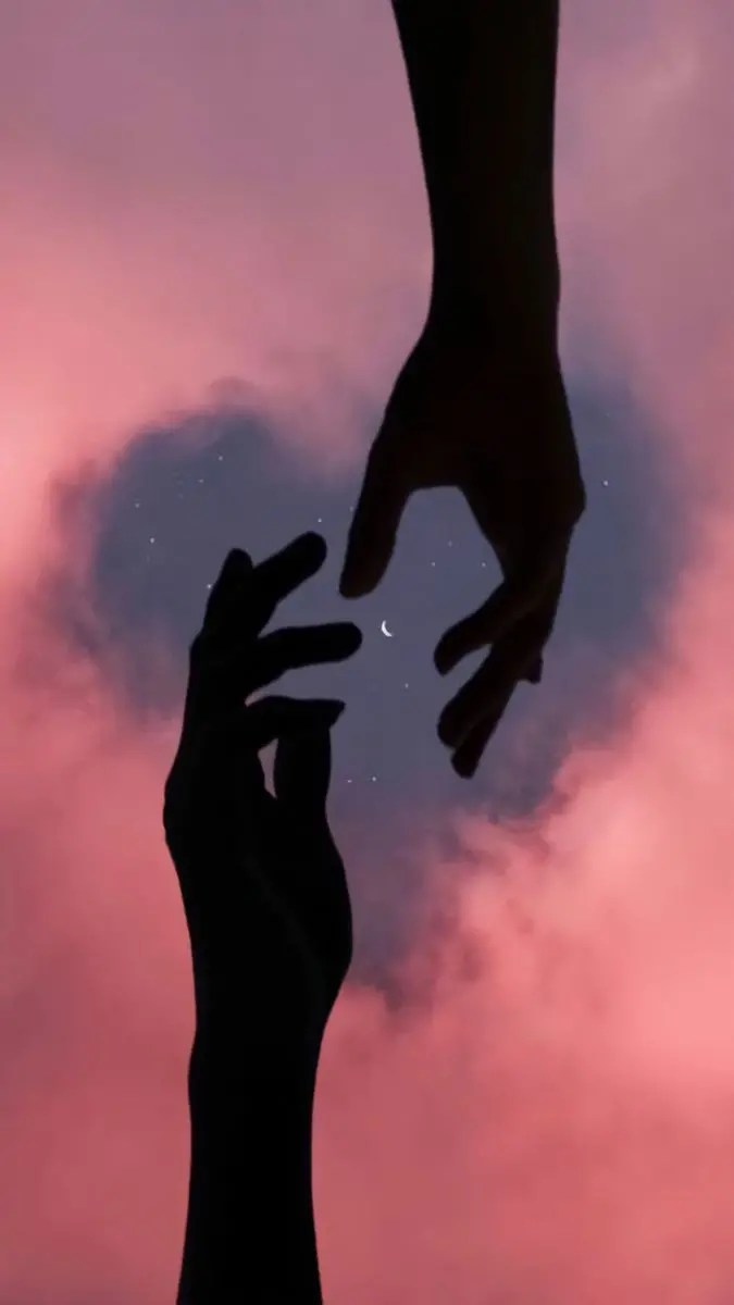 Download attractive wallpaper of hands reaching each other at dusk