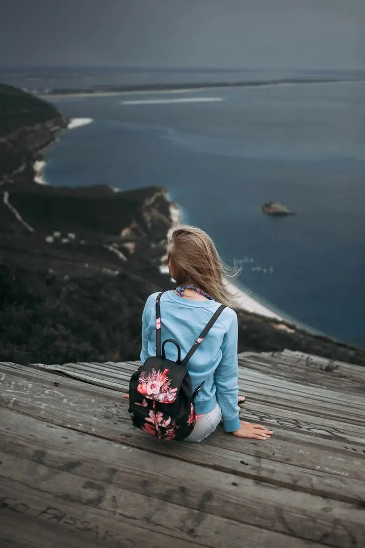 High quality photo of girl from behind in dreamy natural setting