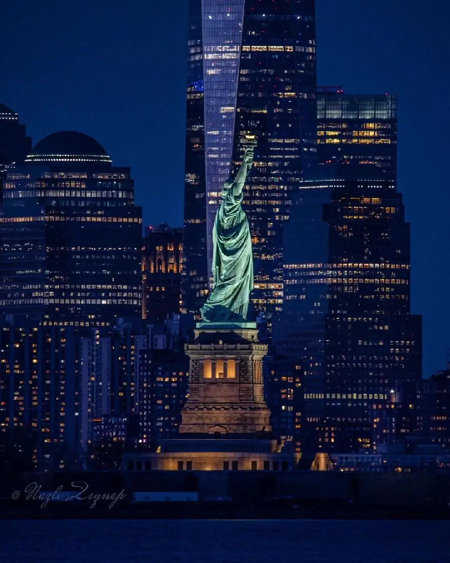 Statue of Liberty at Night Illuminated View Photo
