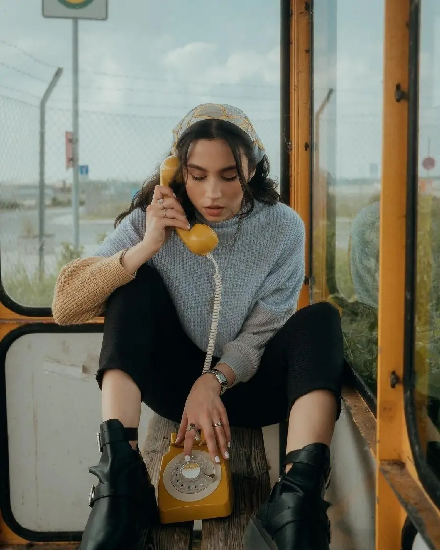 Download creative model pose with retro telephone