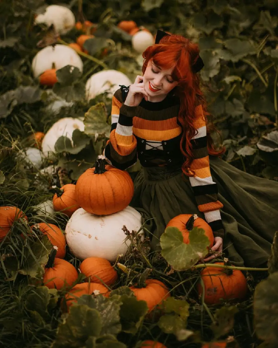 Download female model pose in pumpkin field
