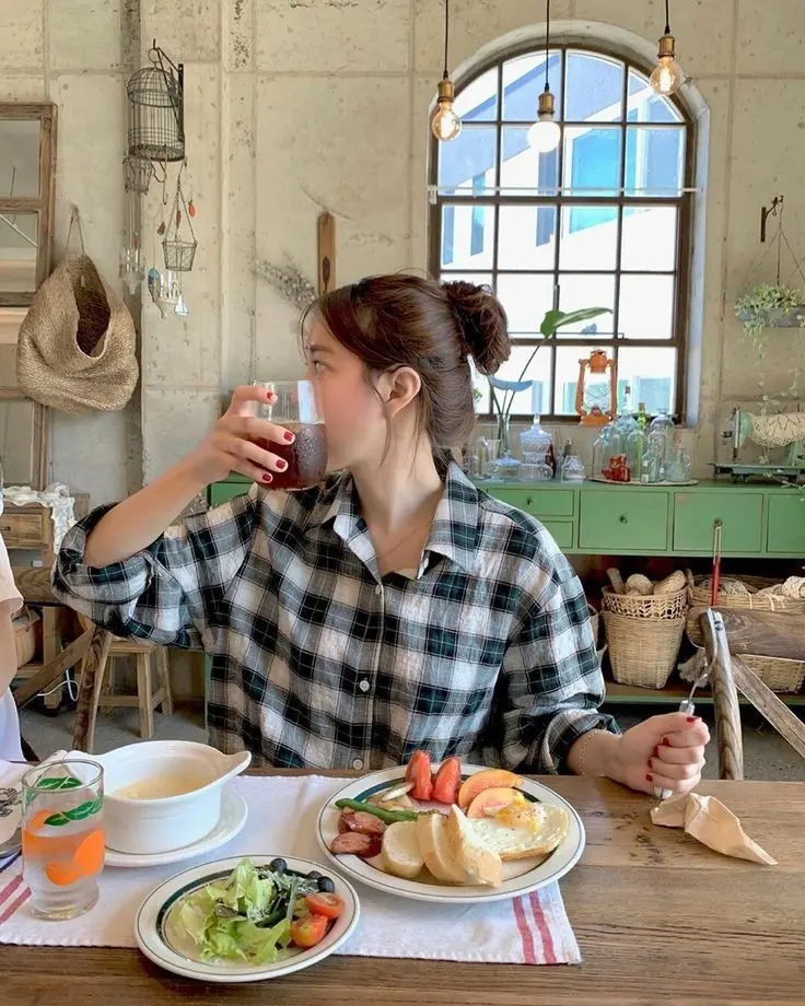 Korean girl eating food in traditional kitchen profile picture