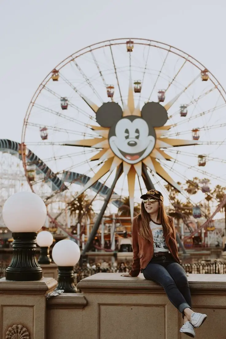 Stylish girl posing by Ferris wheel profile picture