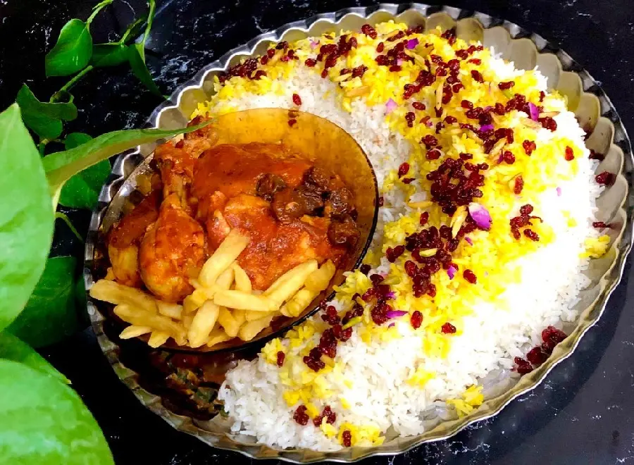 Garnished barberry rice with chicken festive presentation