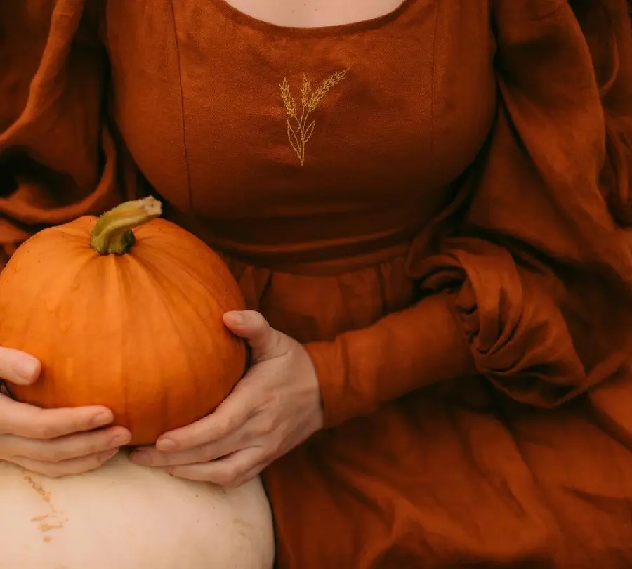 Download female model pose holding pumpkin