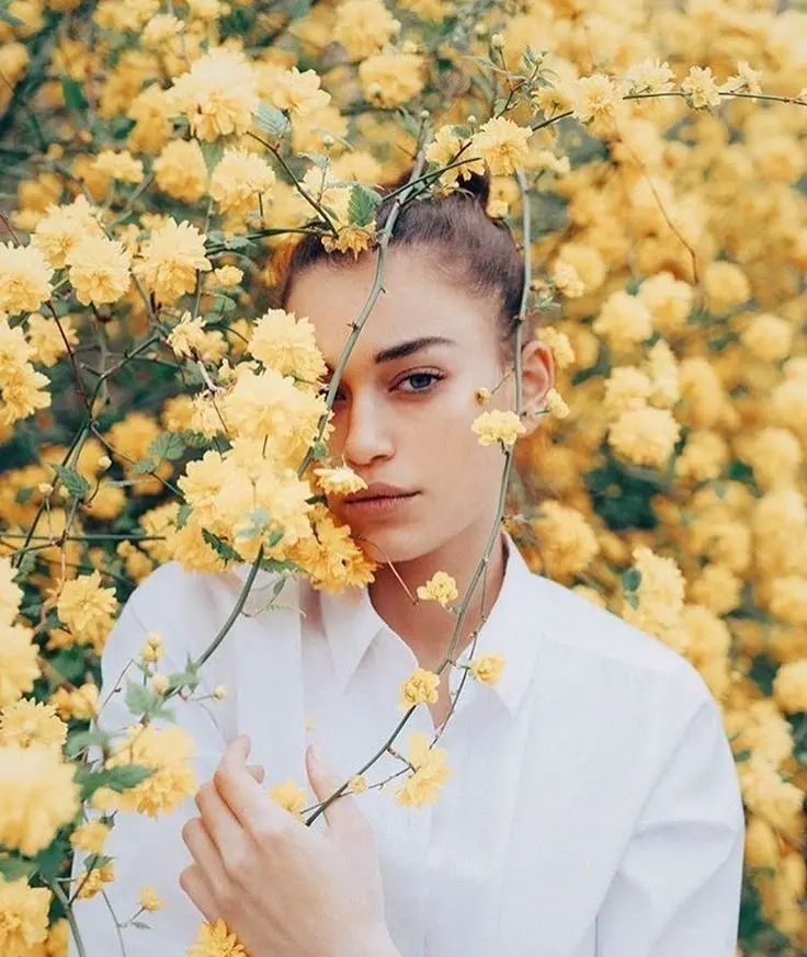 Pretty girl among yellow flowers profile picture for Telegram