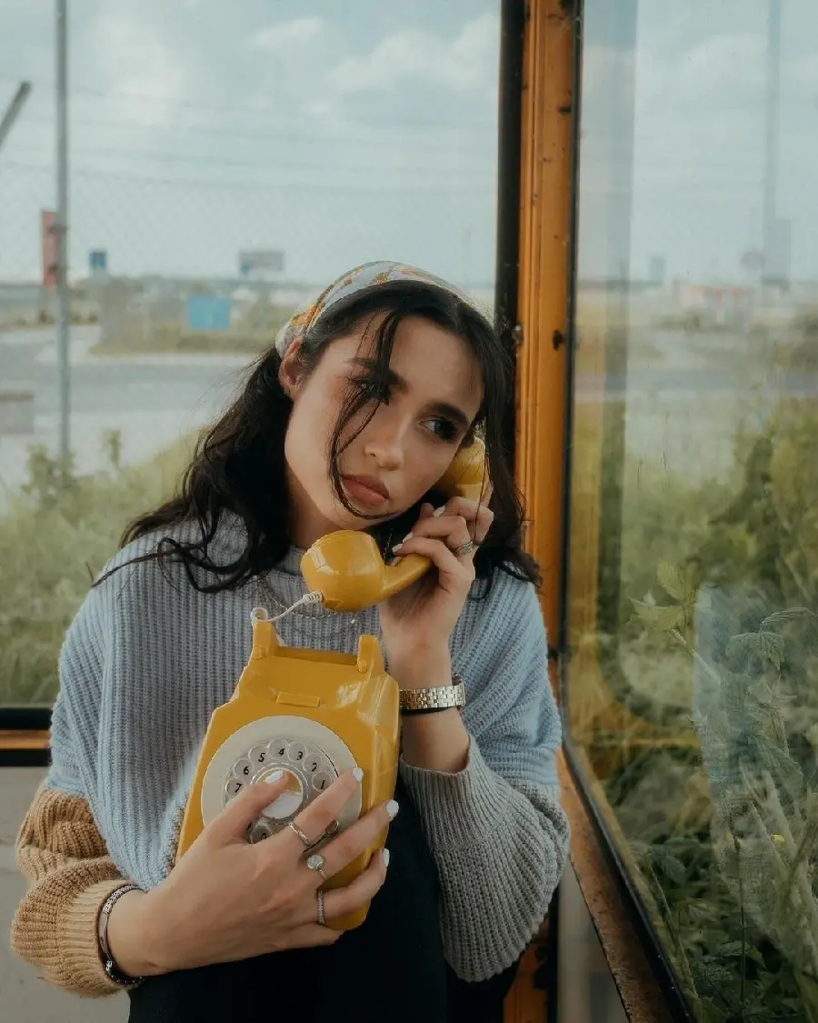 Professional model demonstrating vintage phone pose