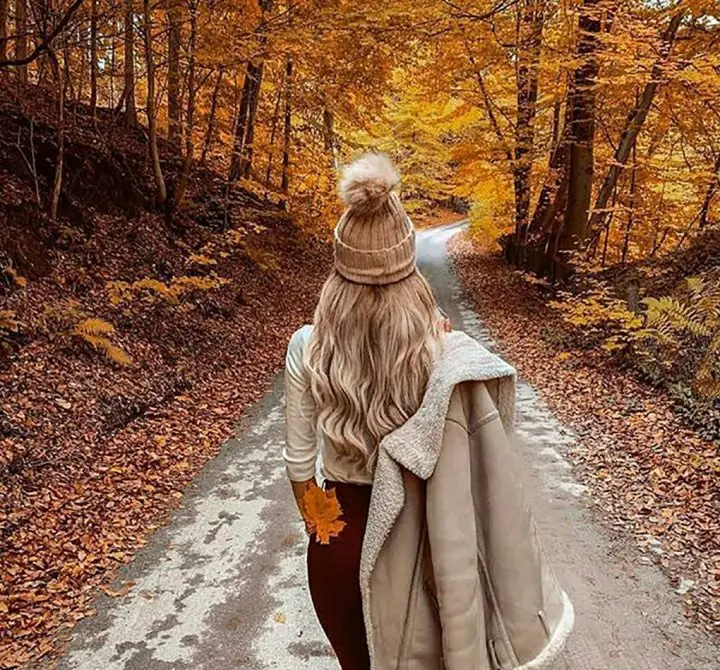Beautiful girl on autumn road photography concept