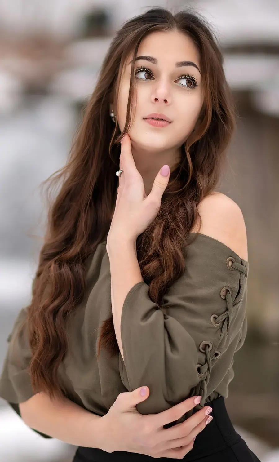 Elegant model lying down while talking on vintage phone