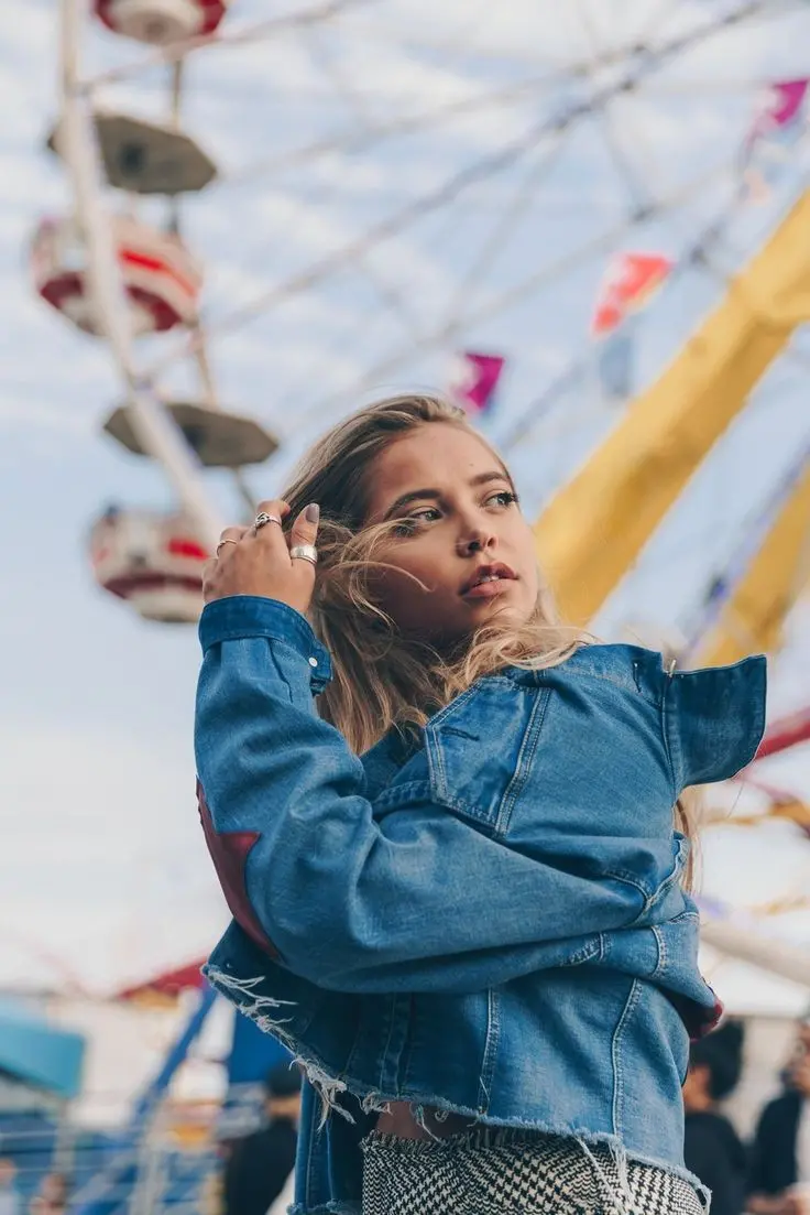 Girl posing at amusement park high quality profile picture
