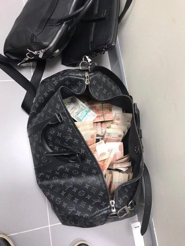 Wallet full of money photo for world laugh and get rich day