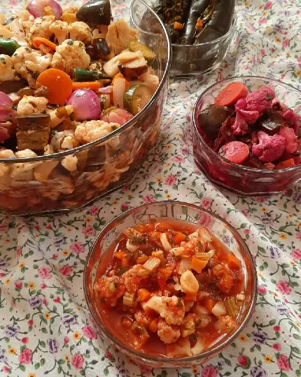 Beautiful image of colorful homemade pickles in bowls