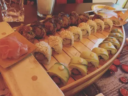 Photo of chic luxury Japanese sushi with salmon and avocado