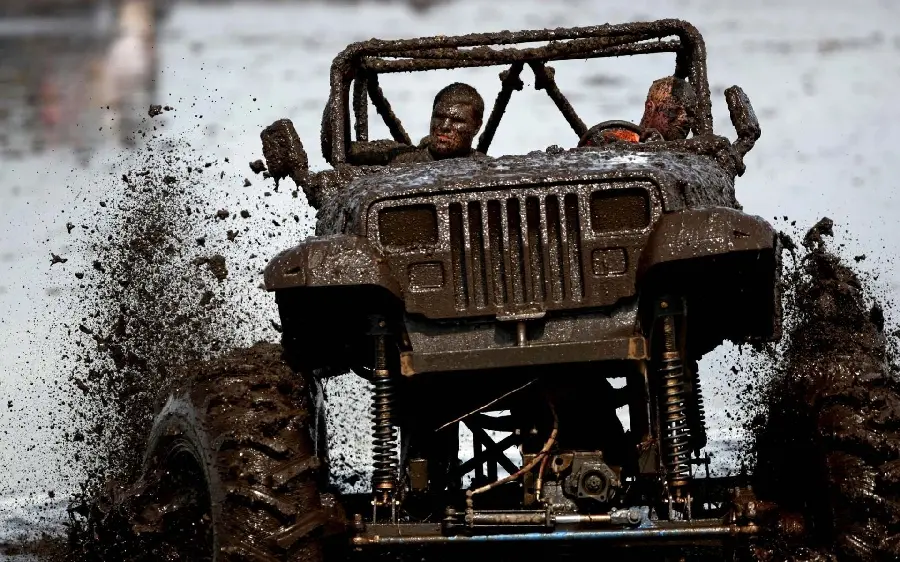 Interesting Photo of Km Jeep with Big Tires Driving Through Mud
