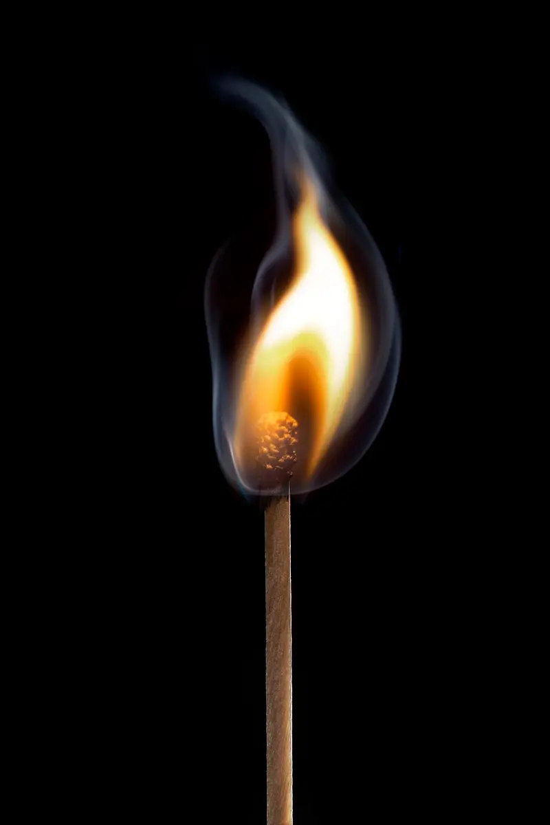 High-quality wallpaper of a lit matchstick