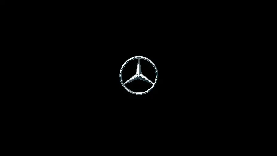 Small silver Mercedes-Benz logo image on black background