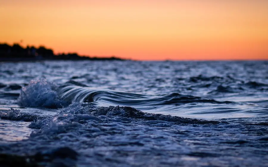 Artistic Image of Sea Waves Close-up with a Very Beautiful Orange Sky