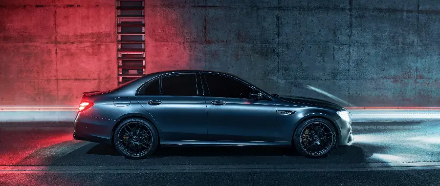 Black Mercedes-Benz AMG E63 in the darkness of the tunnel