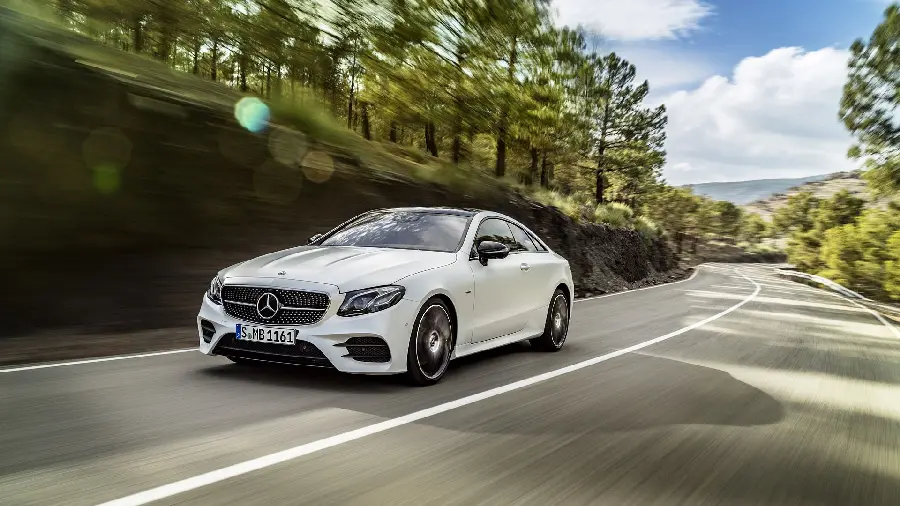 Full HD Background of White Mercedes E300 on a Beautiful Forest Road