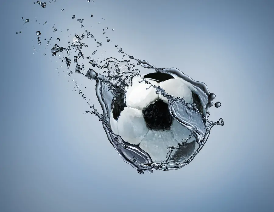 A high-quality and clever photo of a soccer ball being thrown into water for a background
