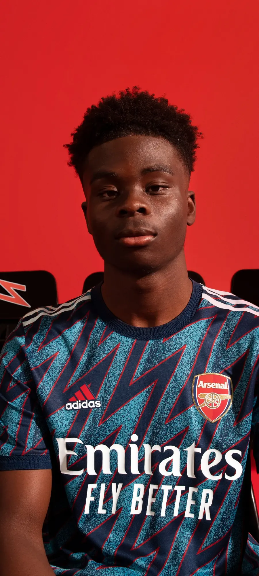 Serious Bukayo Saka photo in Arsenal second kit