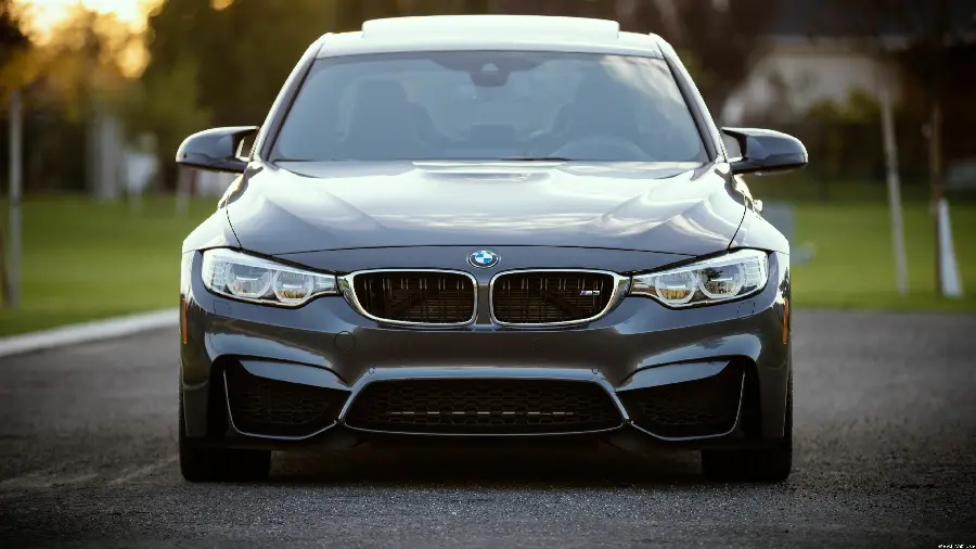 Photo of the front view of a BMW with a special and cool pose for a boy's profile